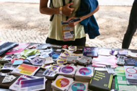 Booth with stickers and pamphlets from the Global Gathering participants